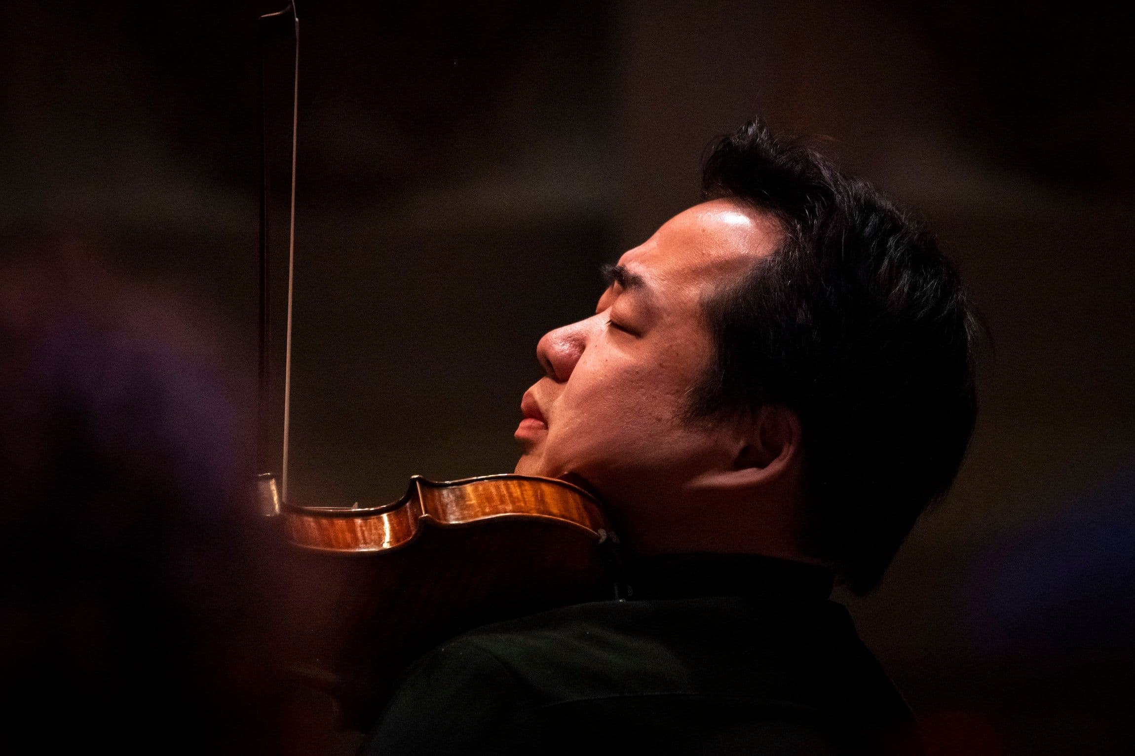 Violinist Ning Feng performs during East Meets West concert in London, Britain
