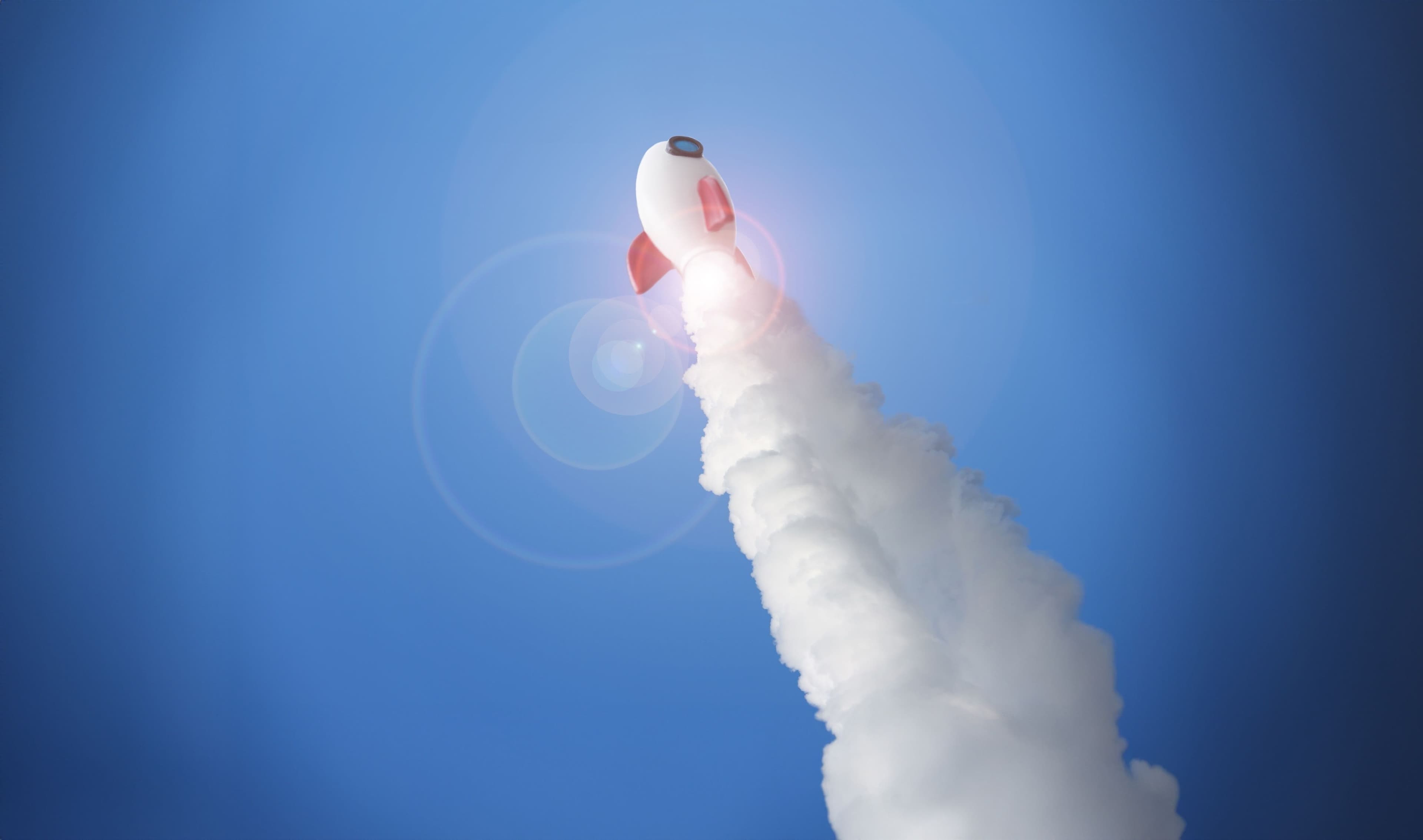 China Wirtschaft, E-Commerce, Innovationen: Eine weiße Rakete fliegt mit hoher Geschwindigkeit vor blauem Himmel